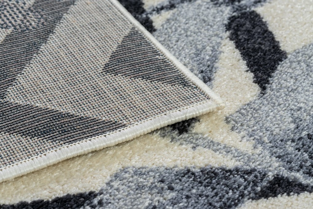 Koberec HEOS 78540 krémovo / modrý LISTY DŽUNGLE