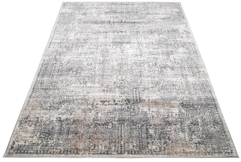Dizajnový moderný koberec so vzorom v hnedých odtieňoch