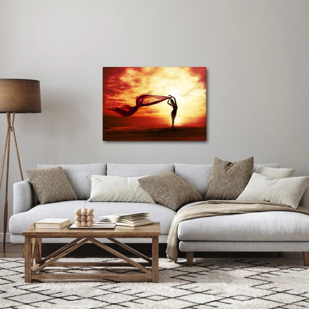 Obraz - Silueta ženy v západu slnka (70x50 cm)