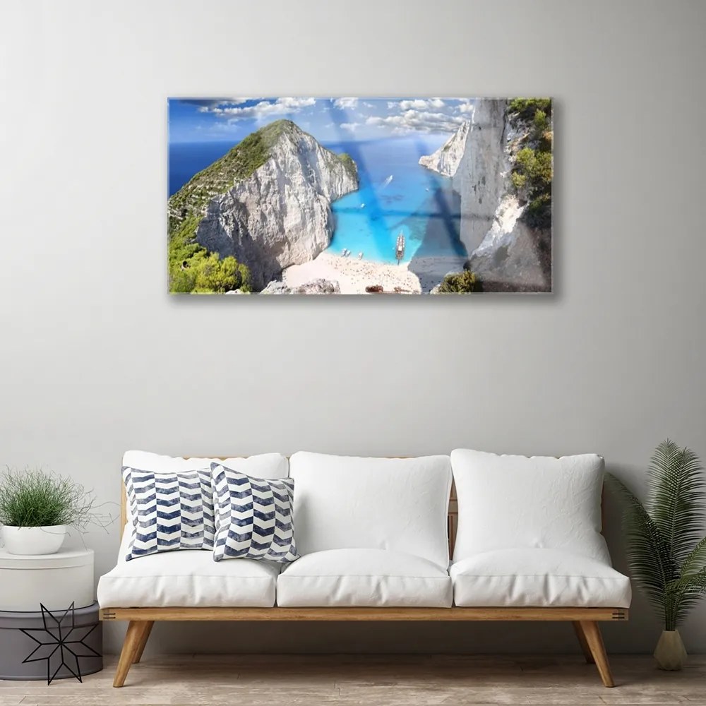 Obraz na akrylátovom skle Záliv hora pláž krajina 100x50 cm