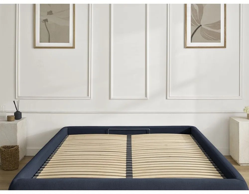 Tmavomodrá čalúnená dvojlôžková posteľ s úložným priestorom/bez čela s roštom 160x200 cm Inera – Bobochic Paris