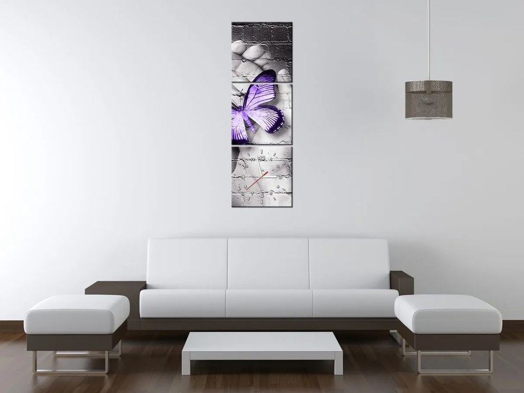 Gario Obraz s hodinami Fialový motýľ na dlaniach - 3 dielny Rozmery: 100 x 70 cm
