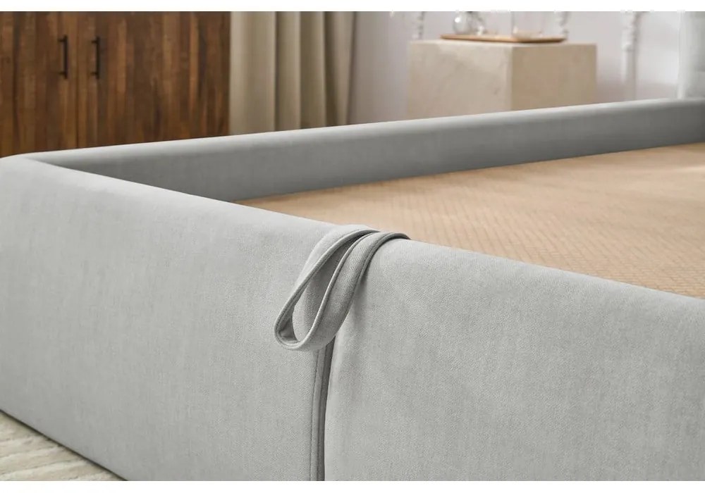 Svetlosivá čalúnená dvojlôžková posteľ s úložným priestorom s roštom 180x200 cm Clothilde – Bobochic Paris