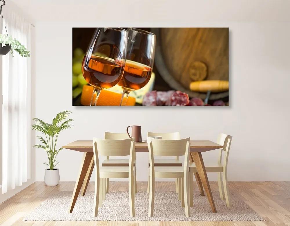 Obraz ružové víno v pohároch - 100x50