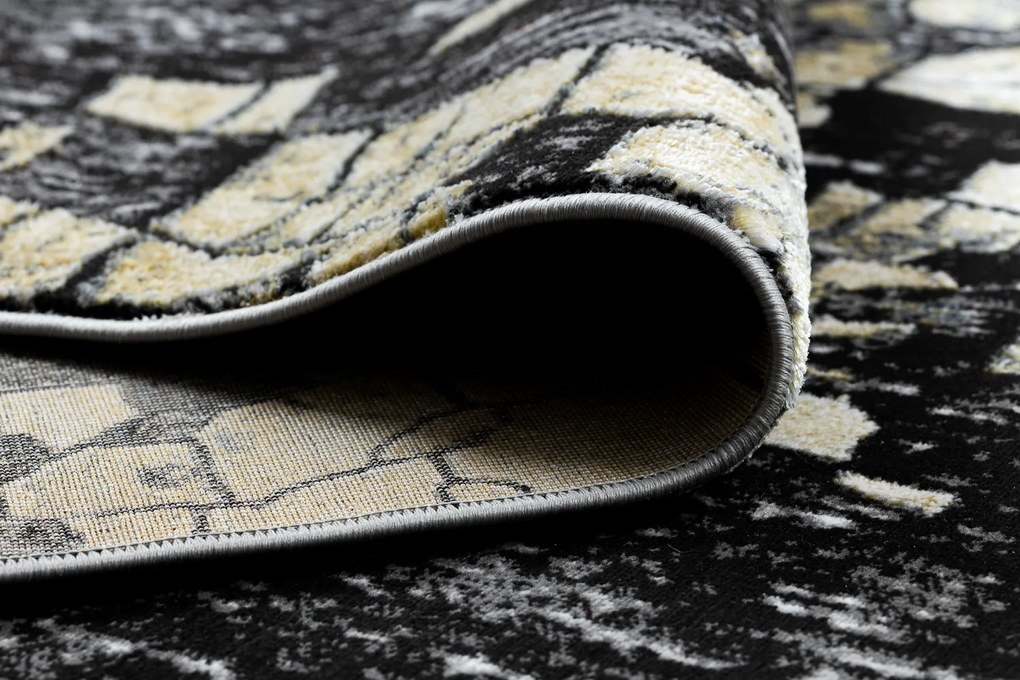 Moderný koberec DE LUXE 2079 Štrukturálny zlatý / sivý