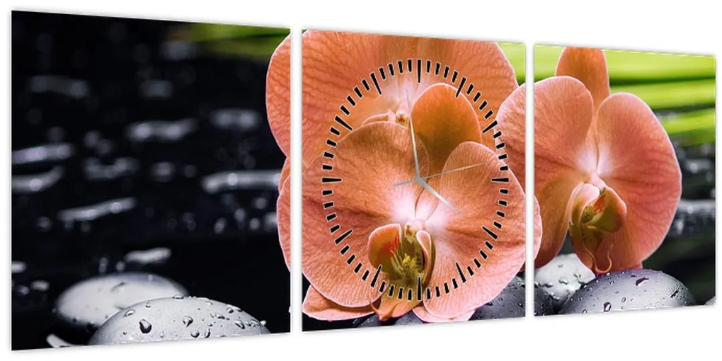 Obraz - Oranžová orchidea s palmovými listami (s hodinami) (90x30 cm)