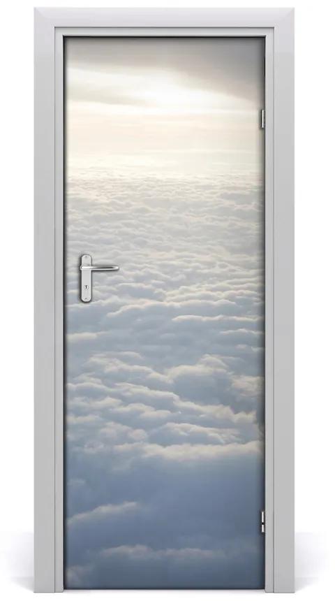 Fototapeta na dvere let nad oblaky 75x205 cm