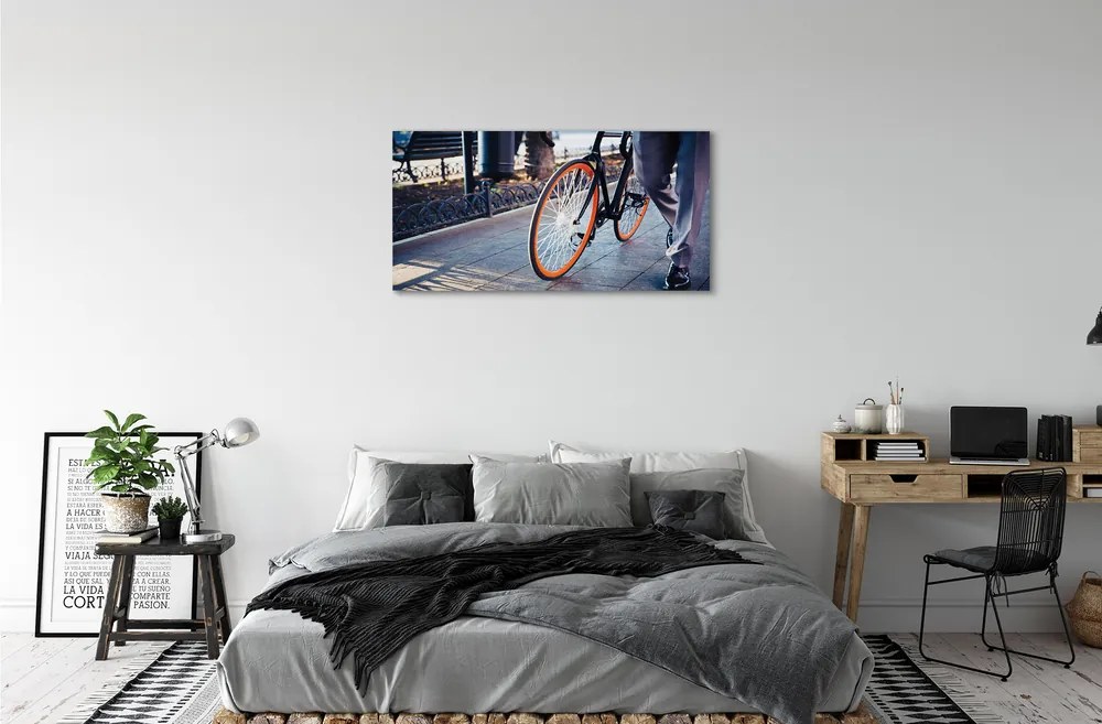 Obraz canvas Mesto na bicykli noha 125x50 cm