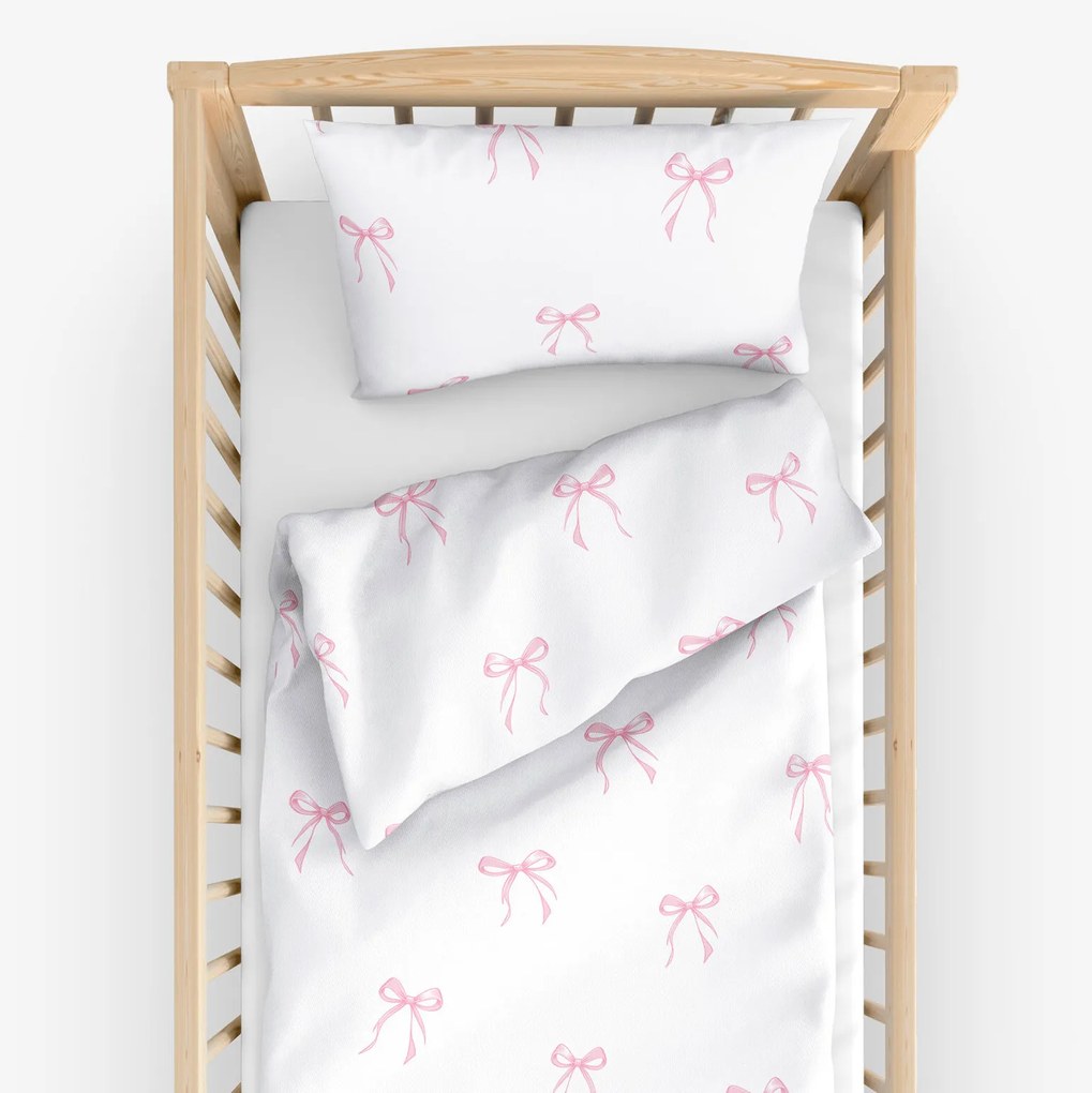 Goldea detské bavlnené obliečky do postieľky - ružové mašličky 100 x 135 a 40 x 60 cm