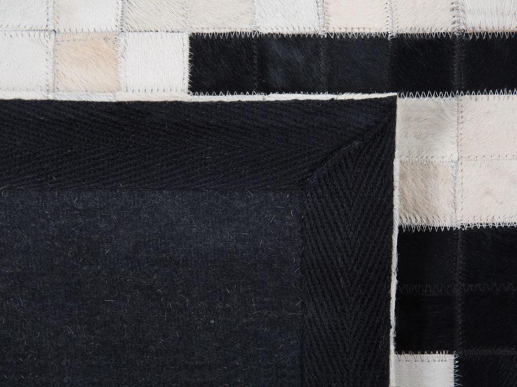 Kožený koberec 80 x 150 cm čierna/biela BOLU Beliani