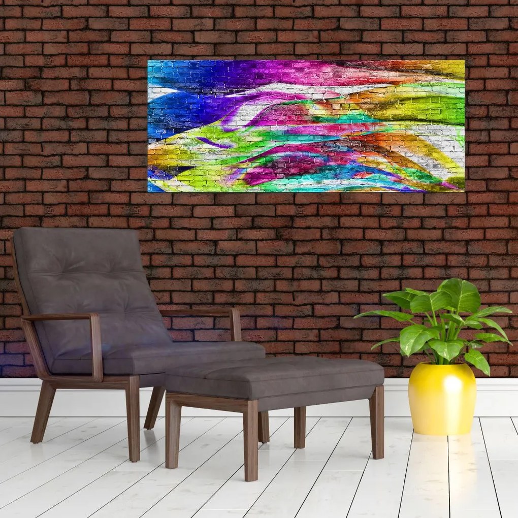 Obraz - Tehlový múr s farebnými plameňmi (120x50 cm)