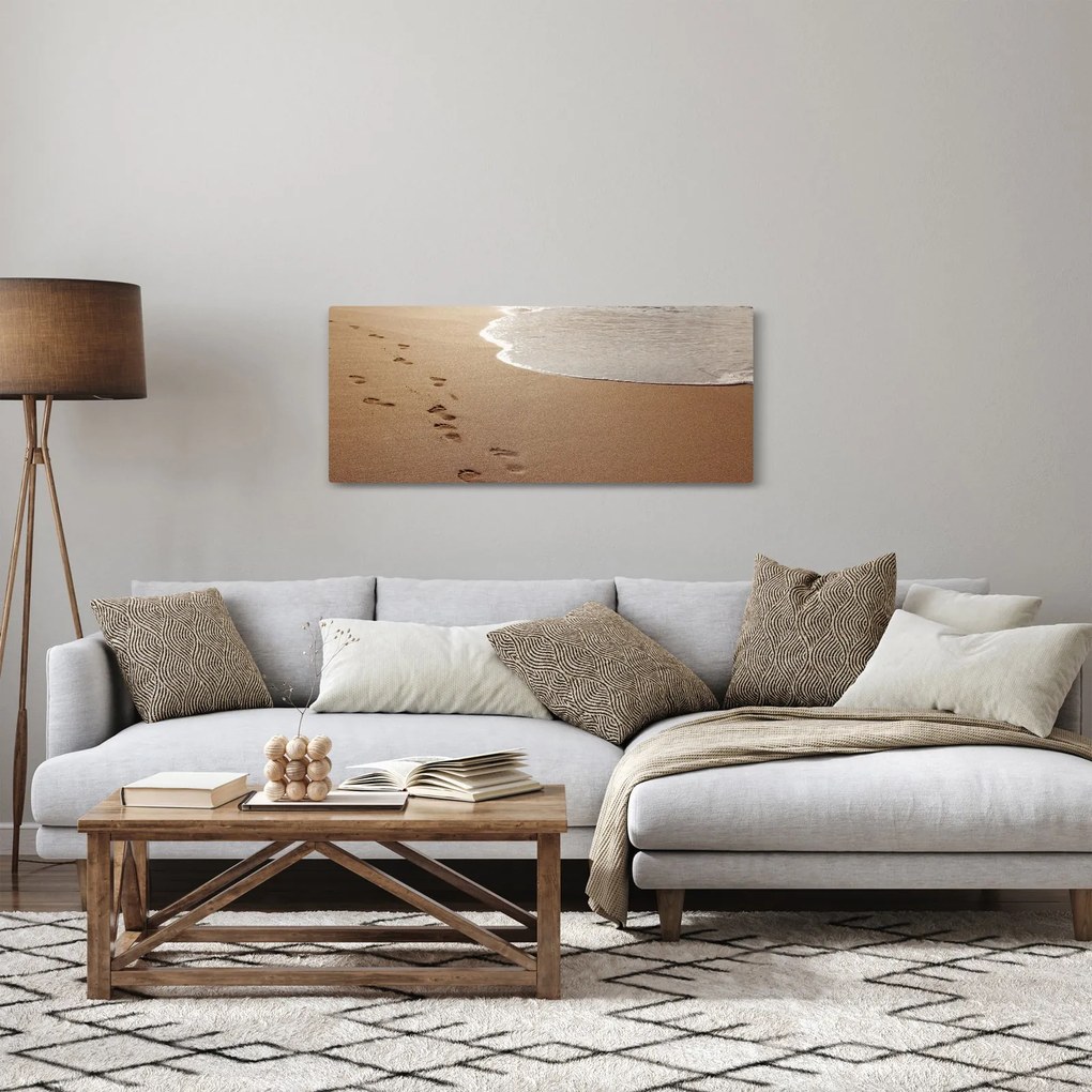 Obraz - stopy v piesku a more (120x50 cm)