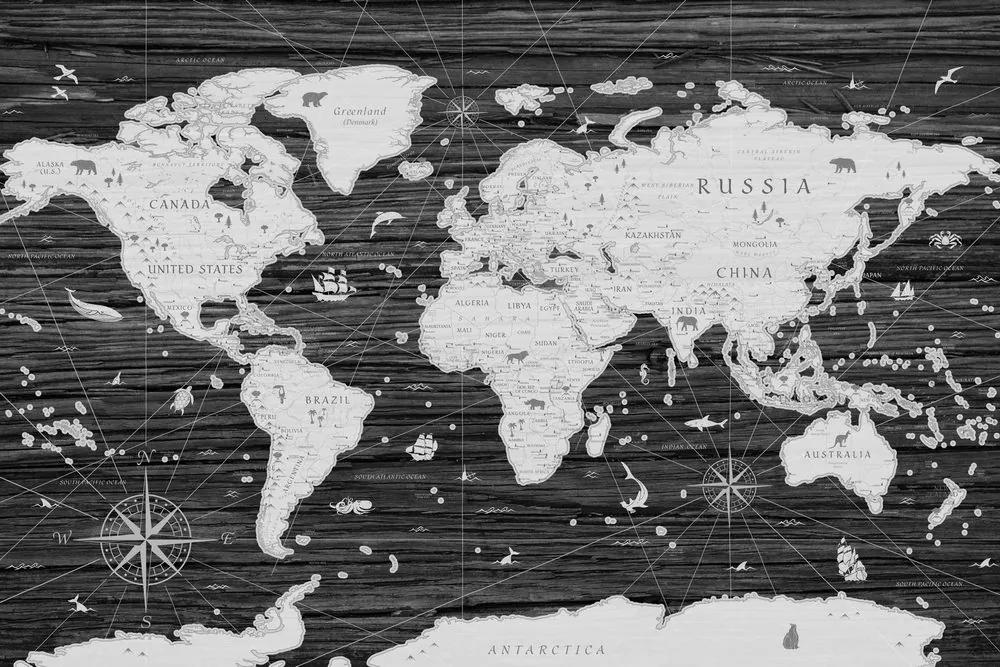 Obraz historická mapa sveta na drevenom pozadí v čiernobielom prevedení