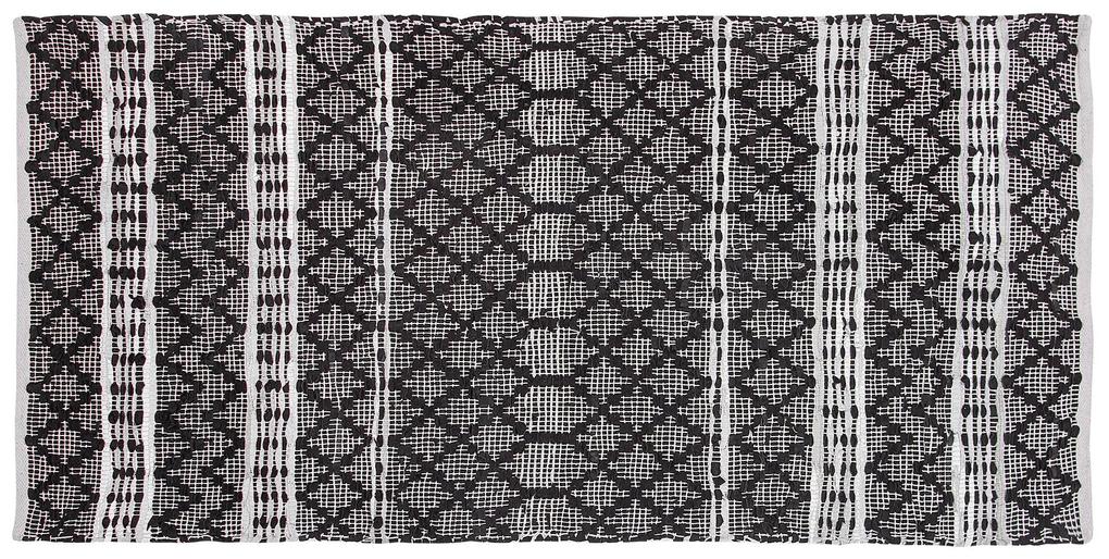 Kožený koberec 80 x 150 cm čierna/béžová FEHIMLI Beliani