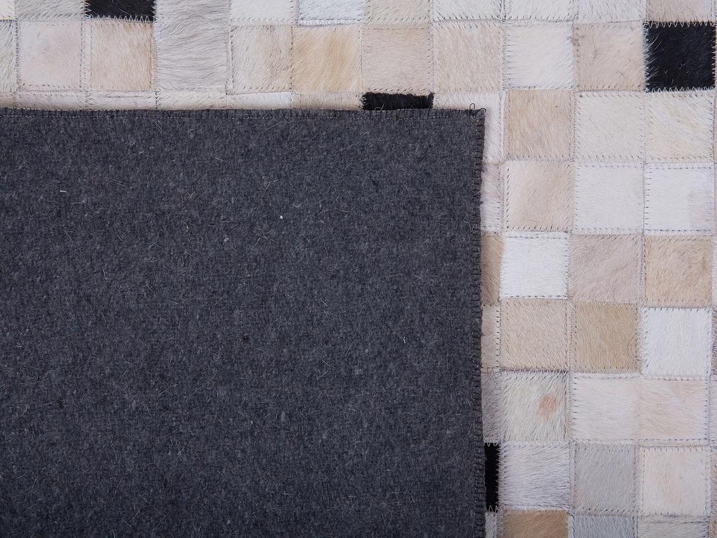 Kožený koberec 160 x 230 cm čierna/béžová ERFELEK Beliani