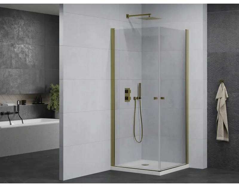 Mexen Pretoria Duo, sprchovací kút s 2-krídlovými dverami 70 (dvere) x 70 (dvere) cm, 6mm číre sklo, zlatý profil + slim sprchová vanička 5cm biela so zlatým sifónom, 852-070-070-50-02-4010G