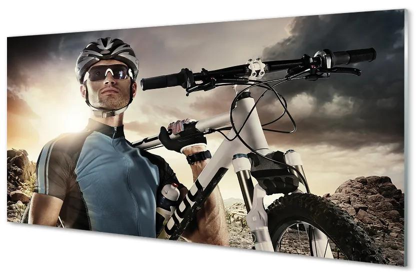 Obraz plexi Cyklista na bicykli mraky 140x70cm