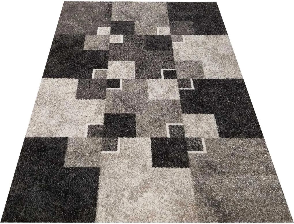 Moderný béžový koberec s motívom štvorcov