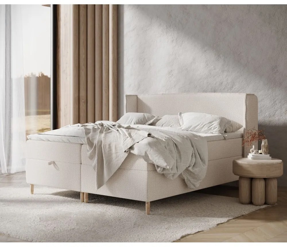 Krémová boxspring posteľ s úložným priestorom 180x200 cm Monpelli – Maison de Rêve