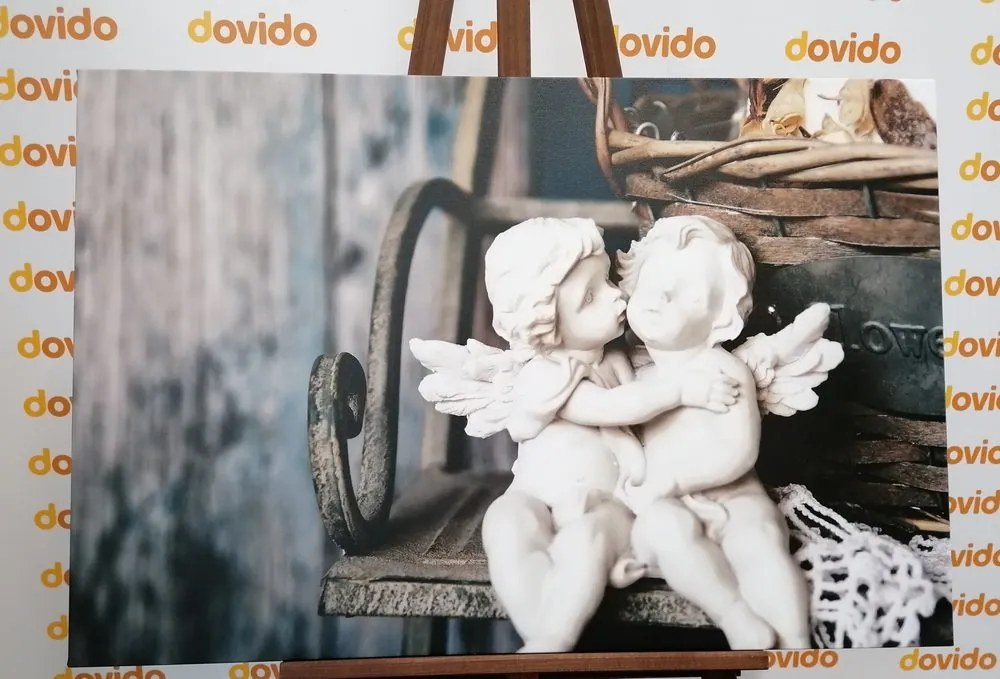 Obraz sošky anjelikov na lavičke