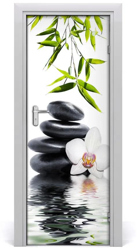Fototapeta samolepiace Orchidea a kamene 85x205 cm