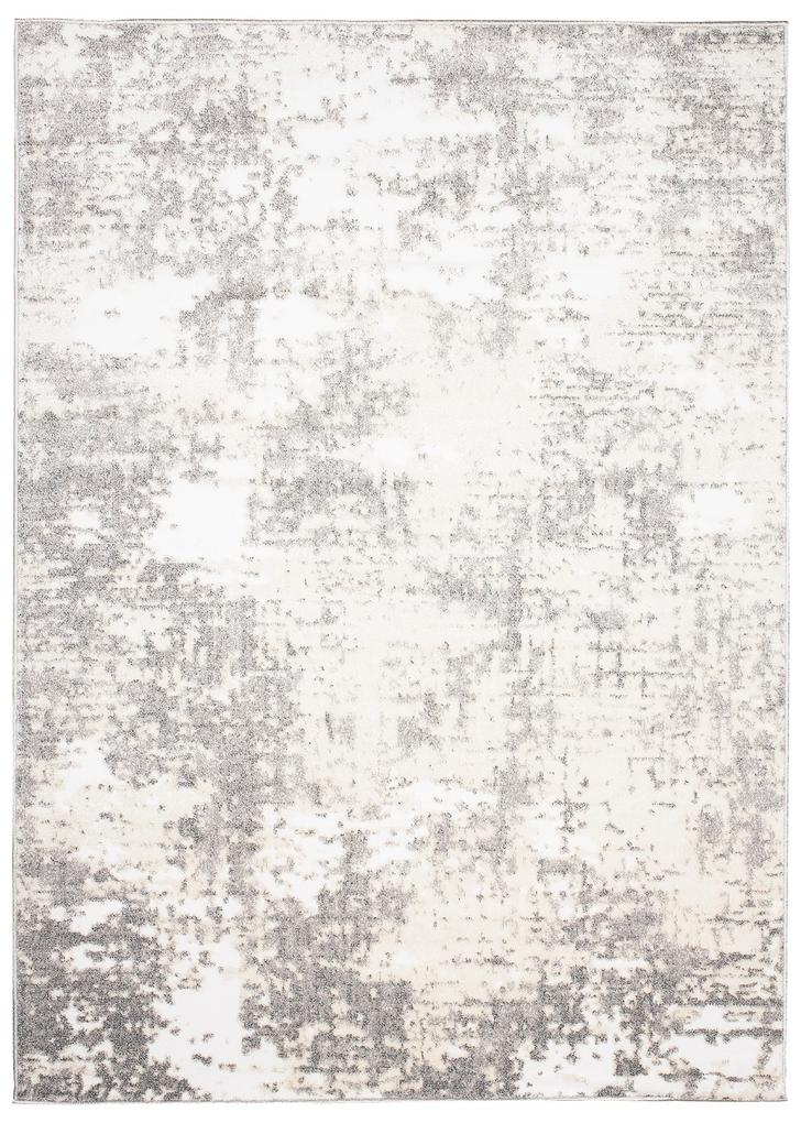 Krémový dizajnový koberec so sivým abstraktným vzorom
