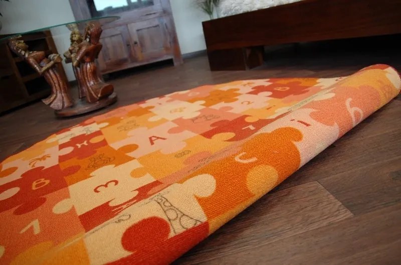 Detský guľatý koberec PUZZLE oranžový