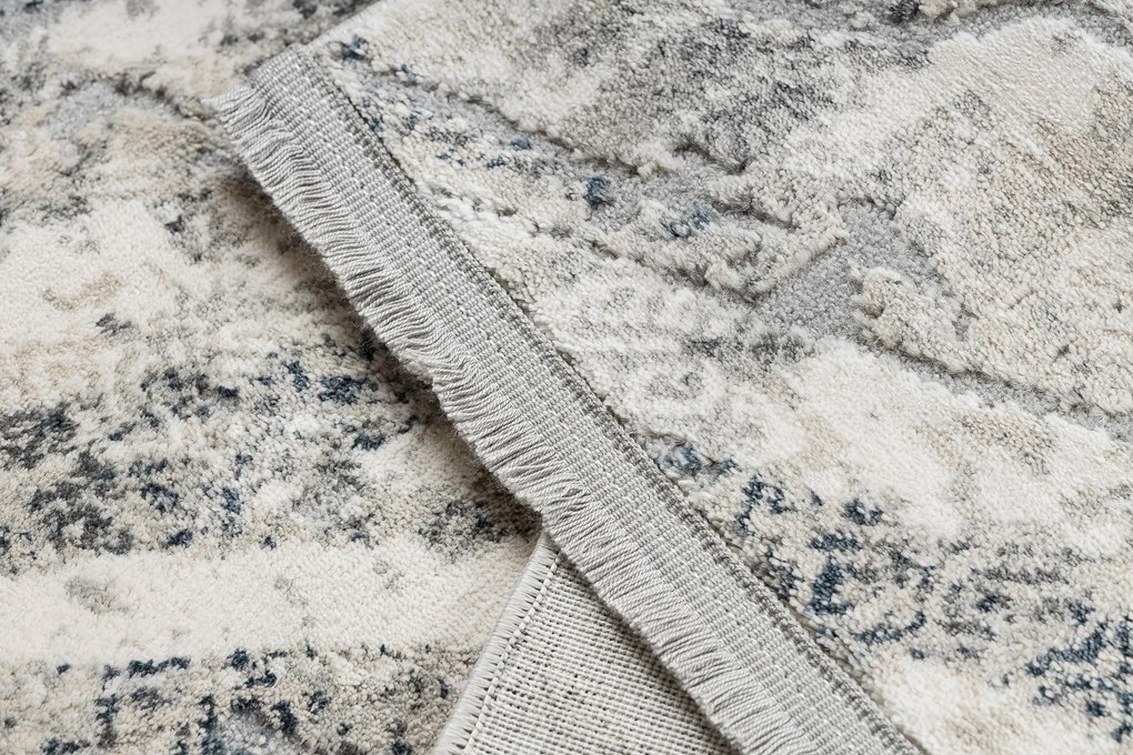 Koberec TULS 51328 s abstraktným vzorom, slonovinová sivá