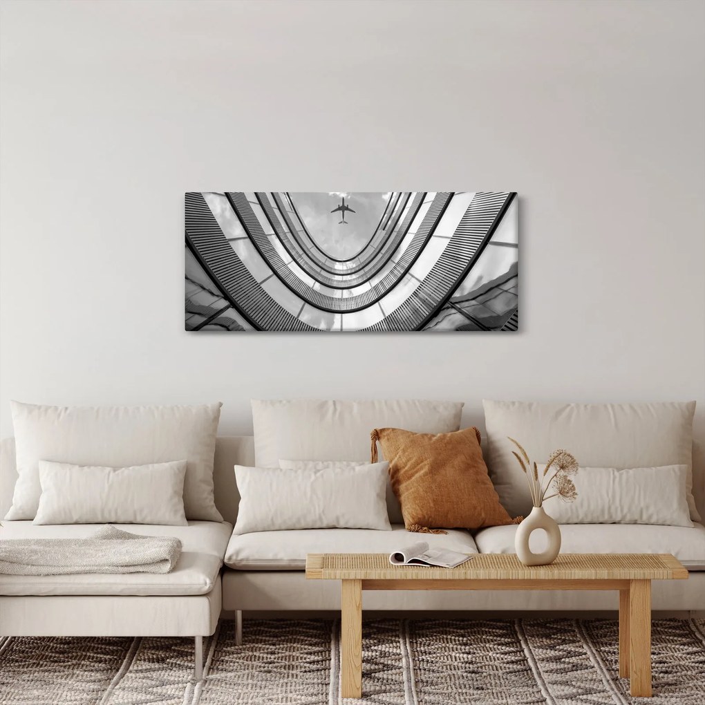 Obraz - Lietadlo nad budovou (120x50 cm)