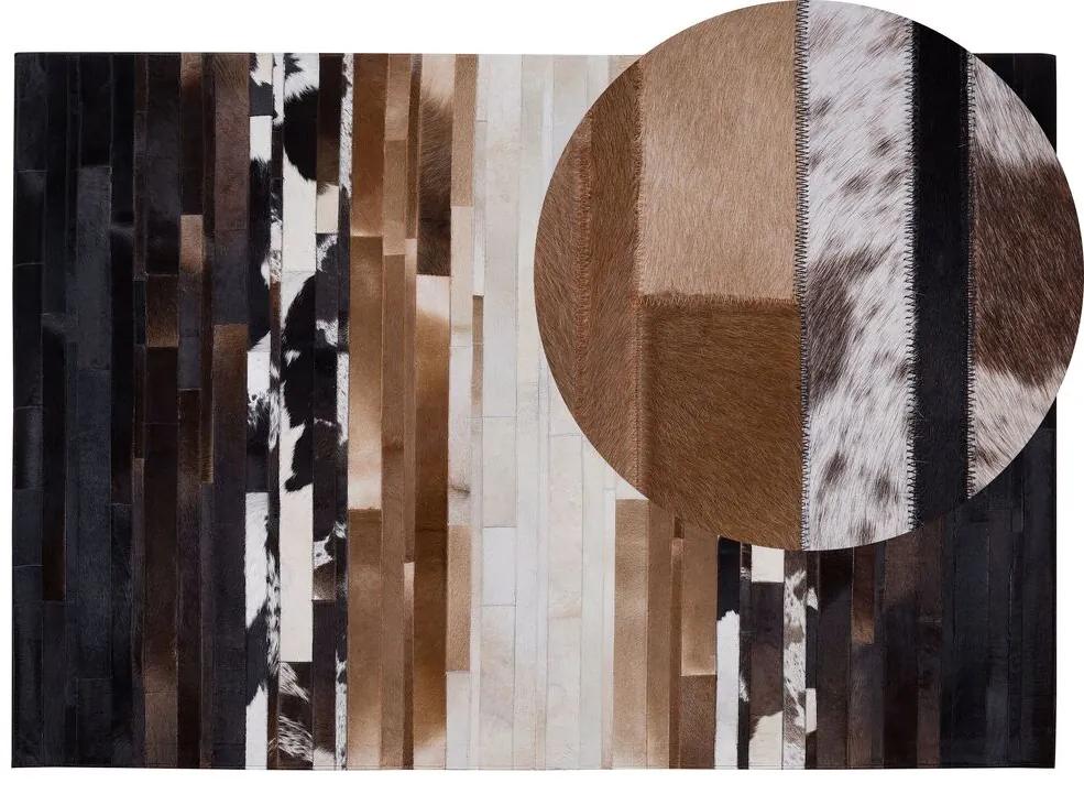 Kožený koberec 140 x 200 cm čierna/béžová DALYAN Beliani