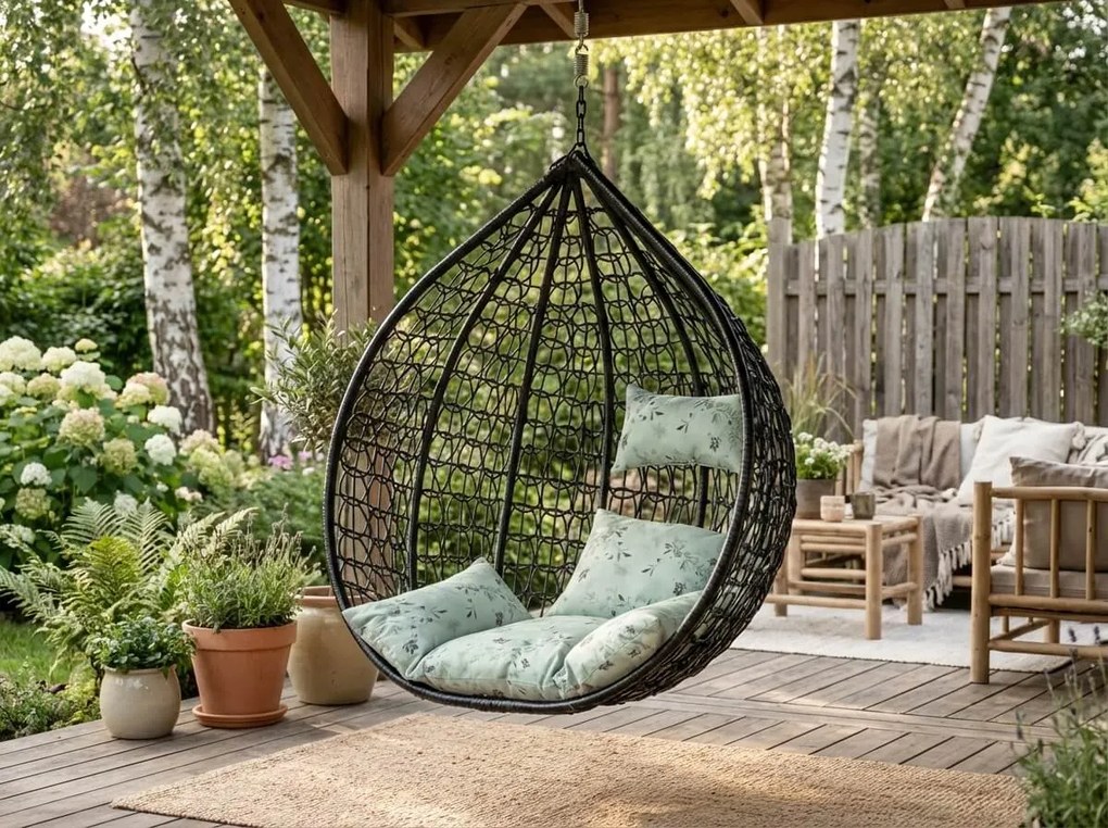 Čierne závesné kreslo KOKON bez stojana, svetlozelený vankúš so vzorom