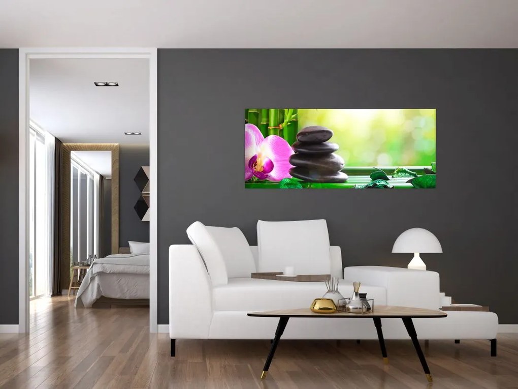 Obraz masážnych kameňov a orchidey na vode (120x50 cm)