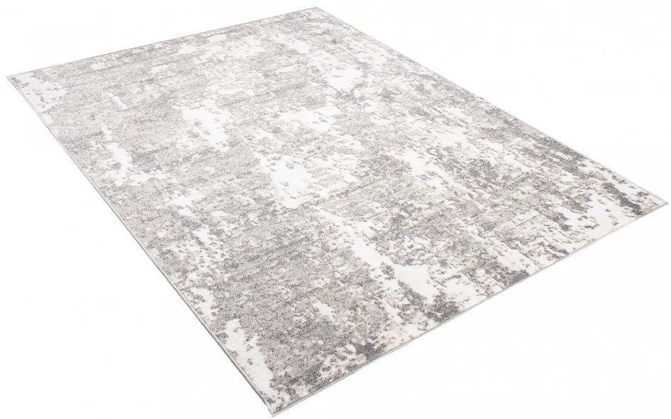 Dizajnový koberec s abstraktným vzorom v krémovej farbe Šírka: 80 cm | Dĺžka: 150 cm