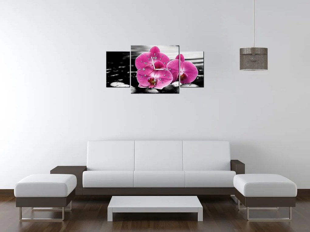 Gario Obraz s hodinami Krásna orchidea medzi kameňmi - 3 dielny Rozmery: 90 x 70 cm