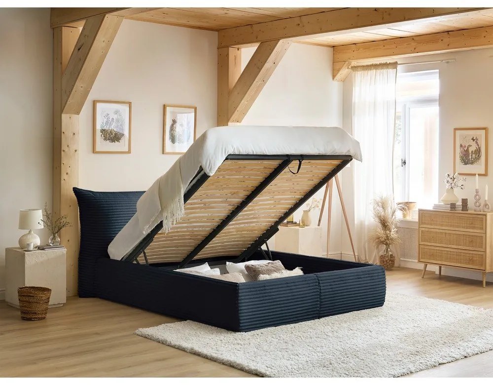 Tmavomodrá čalúnená dvojlôžková posteľ s úložným priestorom a roštom 160x200 cm Jade – Bobochic Paris