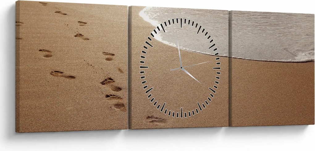 Obraz - stopy v piesku a more (s hodinami) (90x30 cm)