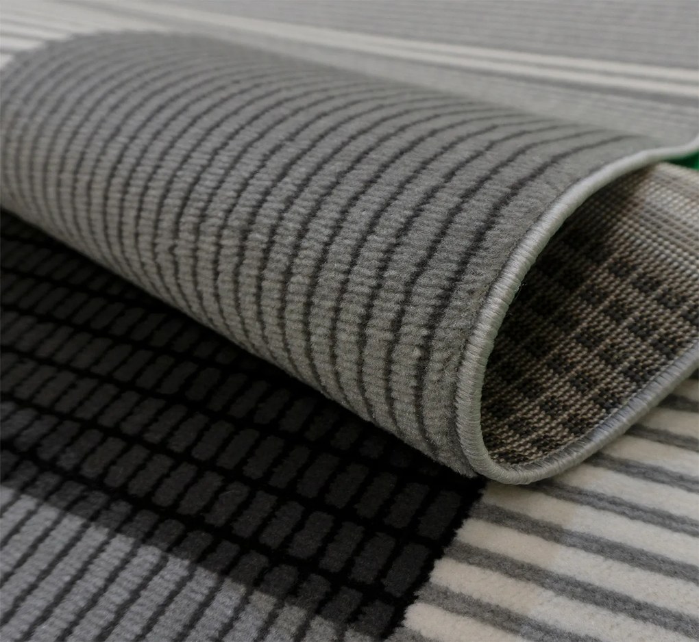 Koberec Lotus 9303 GREY – sivočierny obdĺžnikový koberec Rozmer: 180x260 cm