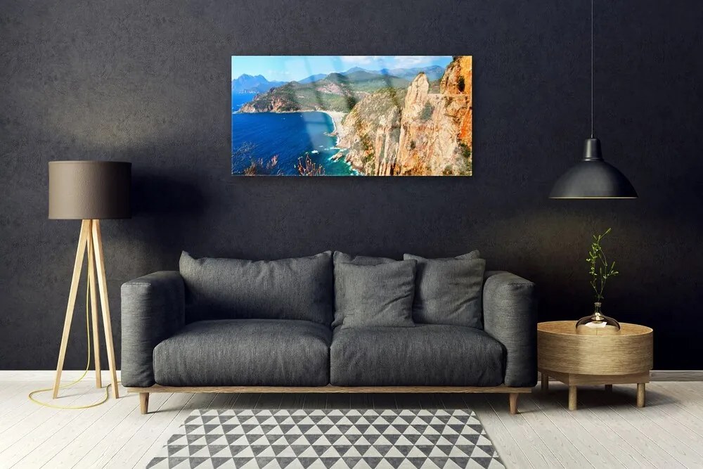 Skleneny obraz Útes pobrežie more hory 100x50 cm
