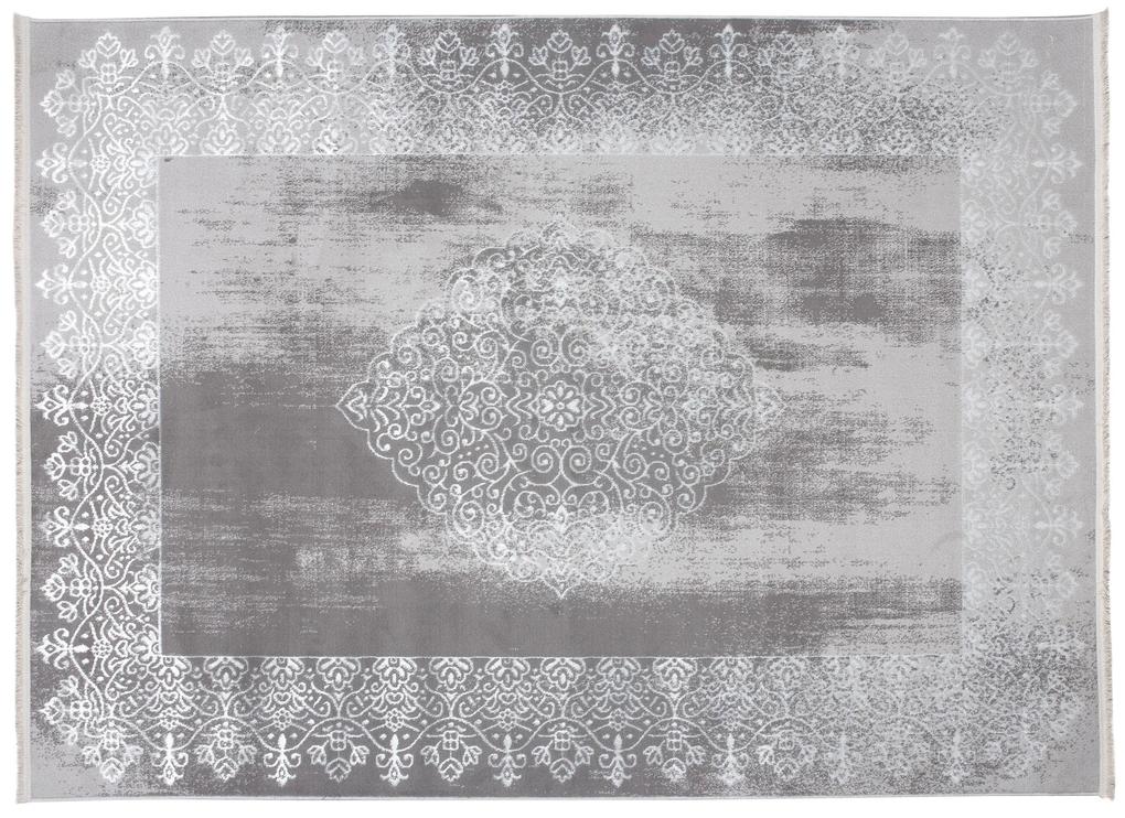 Moderný koberec sivej farby s orientálnym vzorom bielej farby