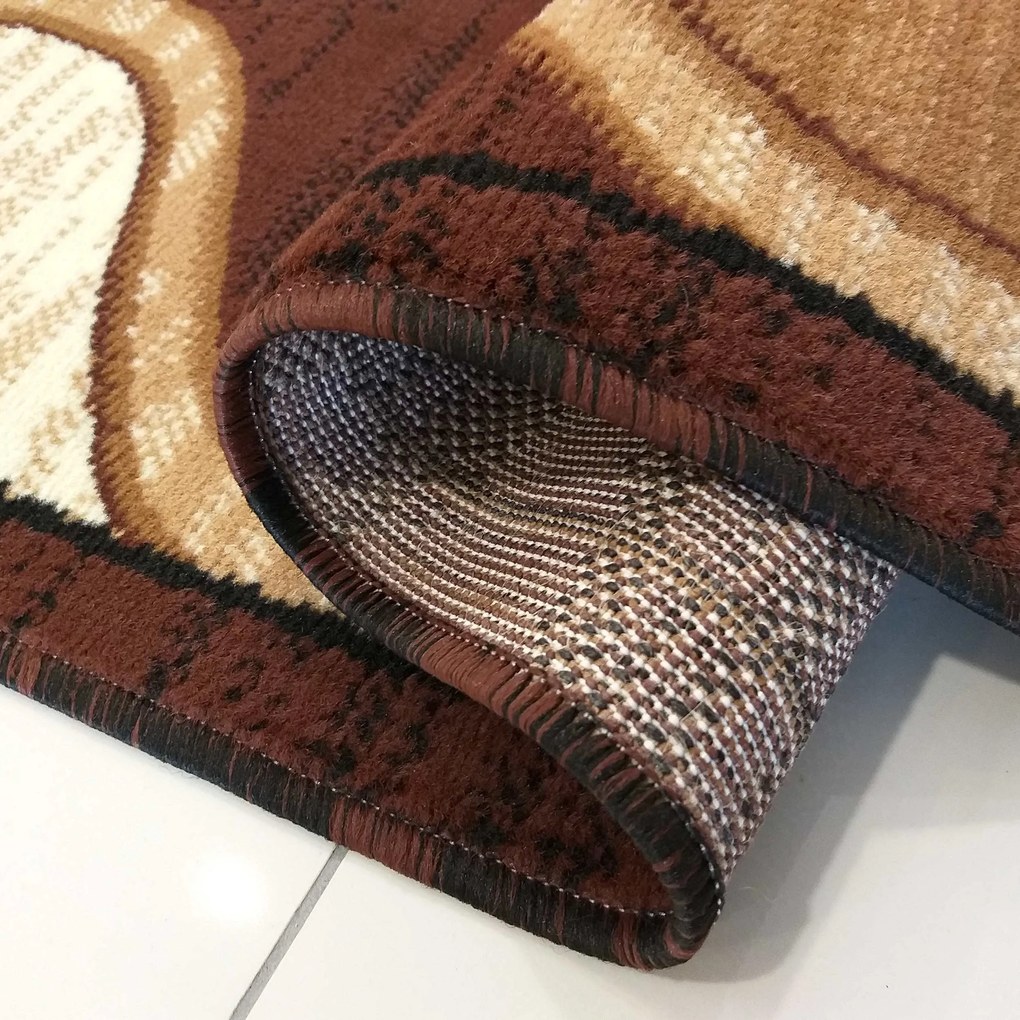 Koberec Alfa 04N – hnedý s abstraktným vzorom do interiéru Rozmer: 60x100 cm