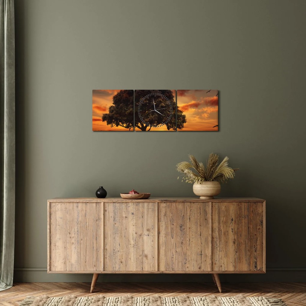 Obraz stromu pri západe slnka (s hodinami) (90x30 cm)