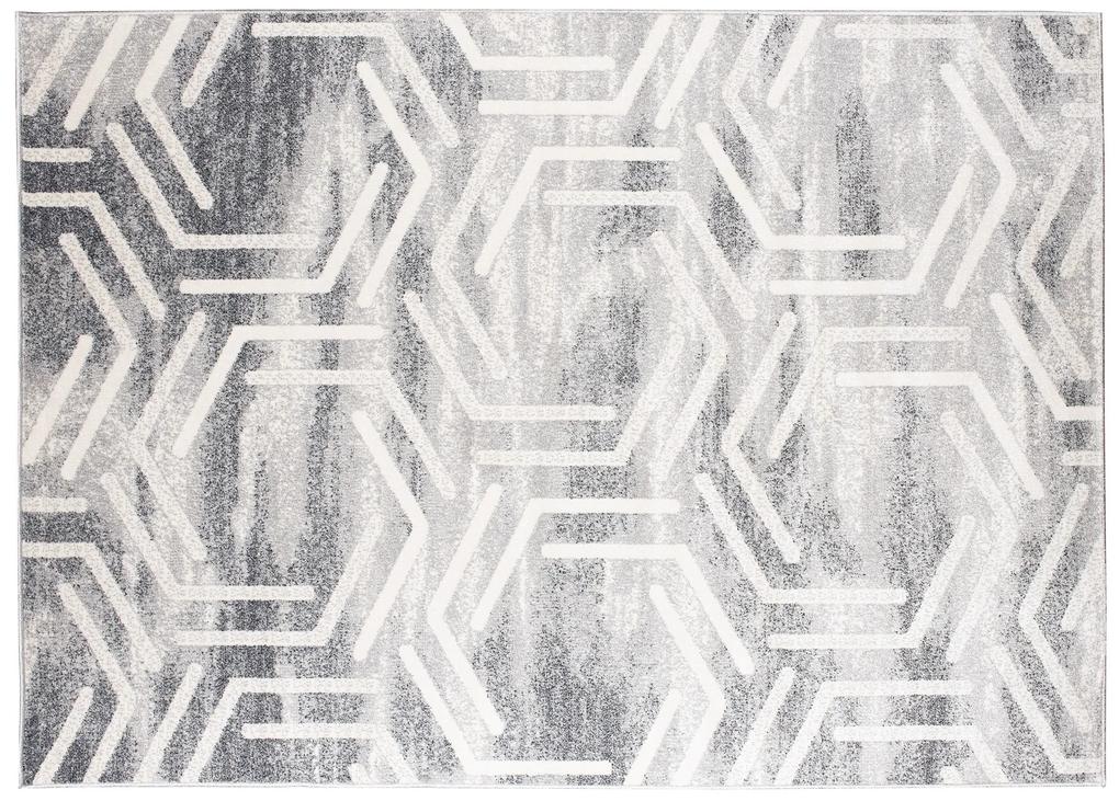 Svetlý dizajnový koberec s geometrickým vzorom