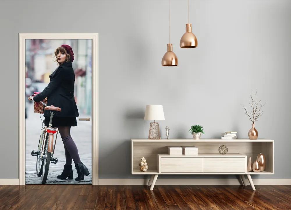 Fototapeta samolepiace dvere žena na bicykli 95x205 cm