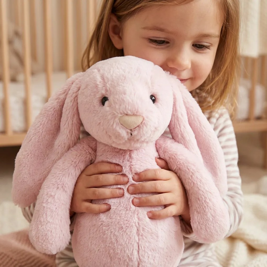 Roztomilý ružový plyšový zajačik