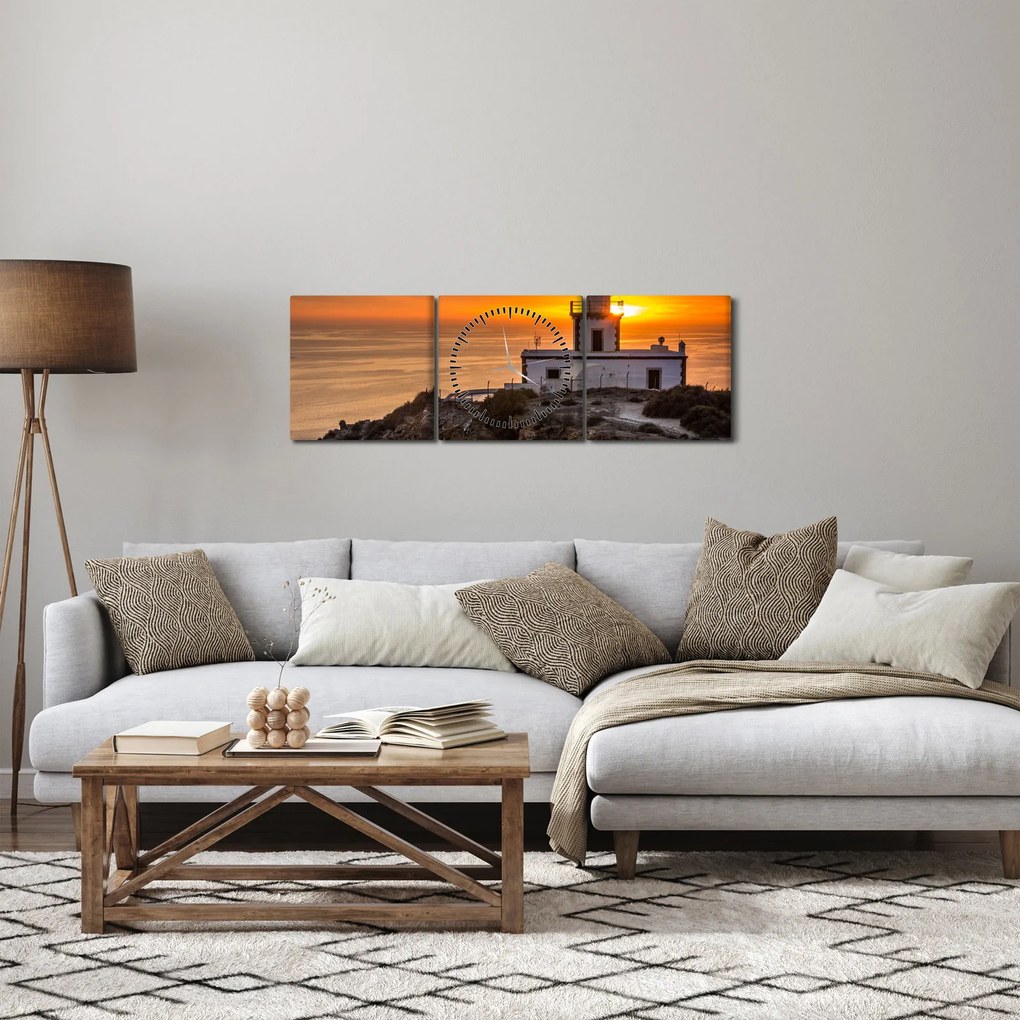Obraz majáka pri západe slnka (s hodinami) (90x30 cm)