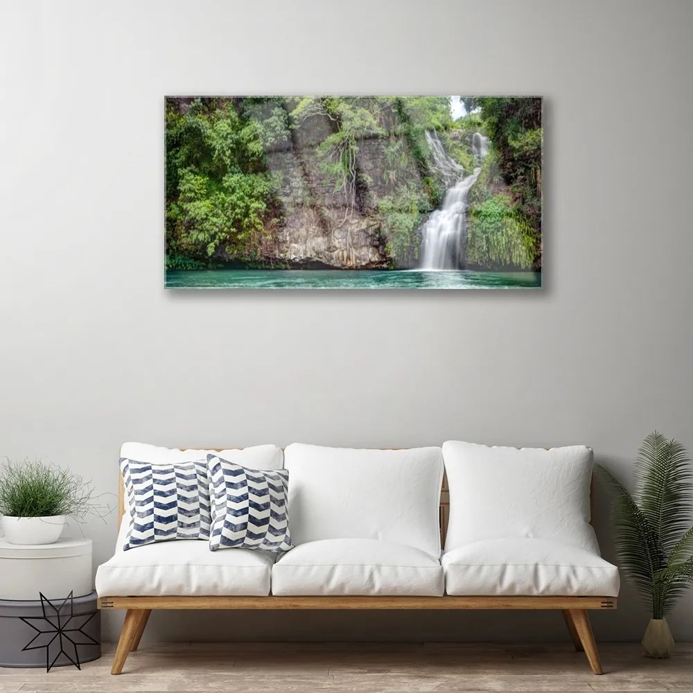 Obraz na skle Vodopád skala príroda 140x70 cm
