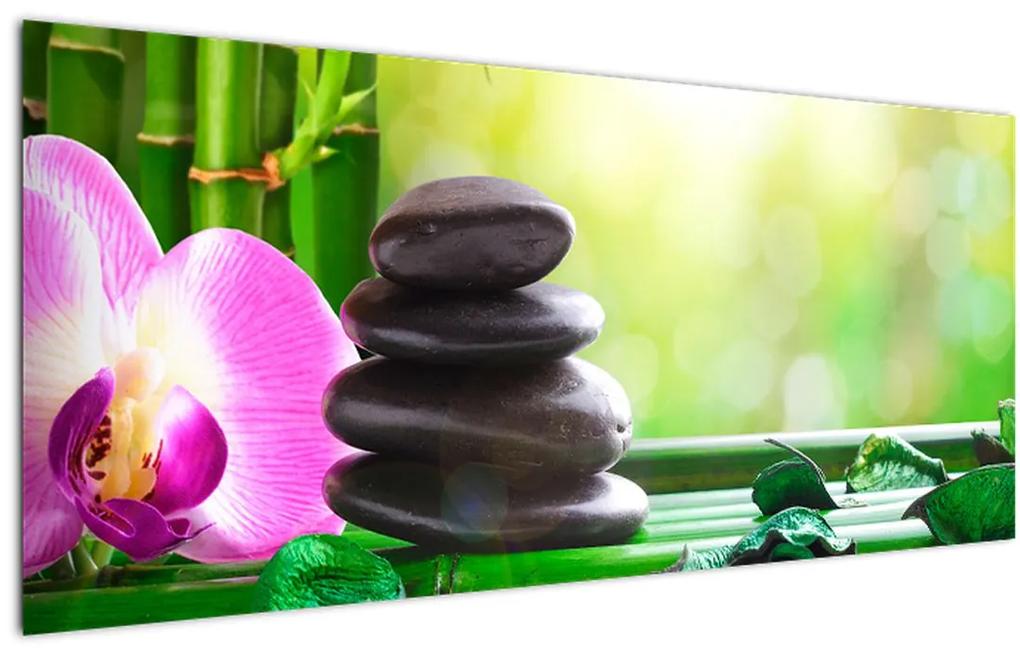 Obraz masážnych kameňov a orchidey na vode (120x50 cm)