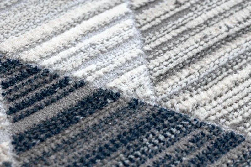 Moderný koberec REBEC strapce 51166B Geometrický -tmavo/modrý - krémový