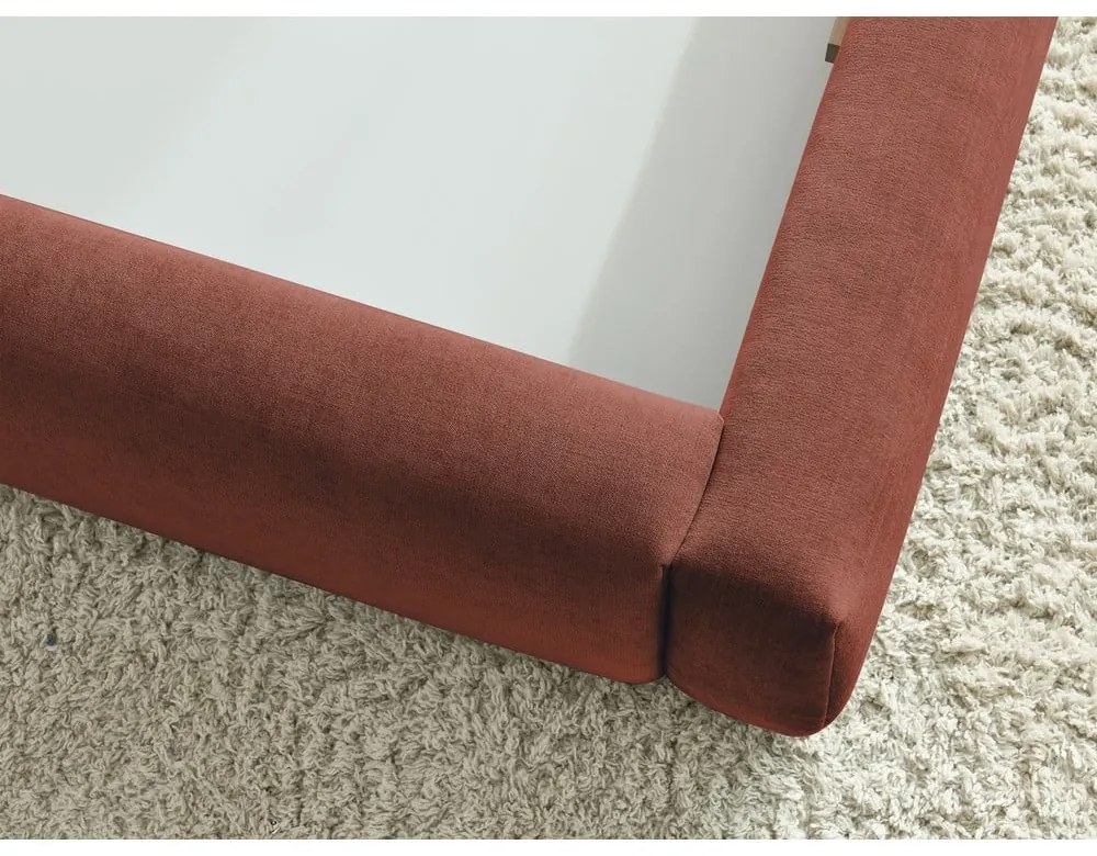 Oranžová čalúnená dvojlôžková posteľ s úložným priestorom s roštom 180x200 cm Vernon – Bobochic Paris