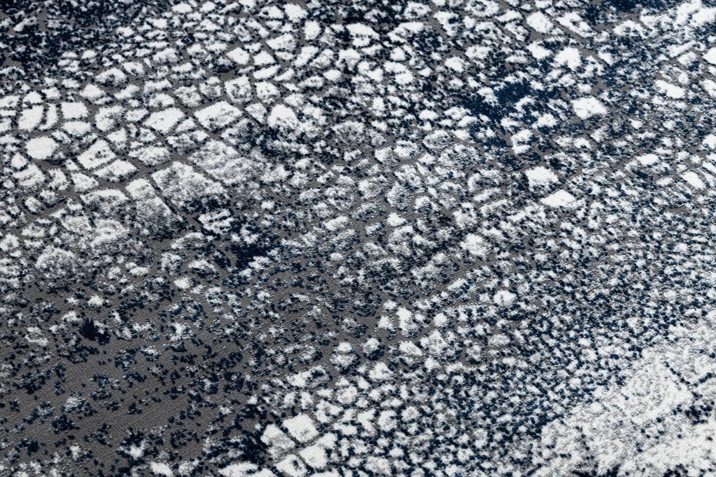 Moderný koberec DE LUXE 528 Abstrakcia - Štrukturálny krém / tmavomodrý